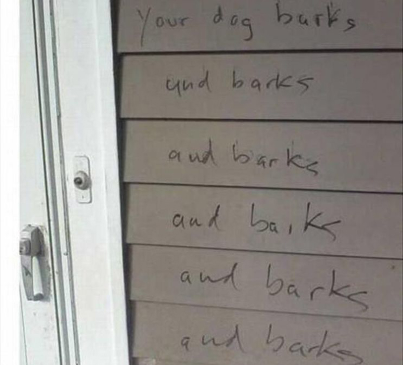 Someone wrote directly on a neighbor's wall about their barking dog.