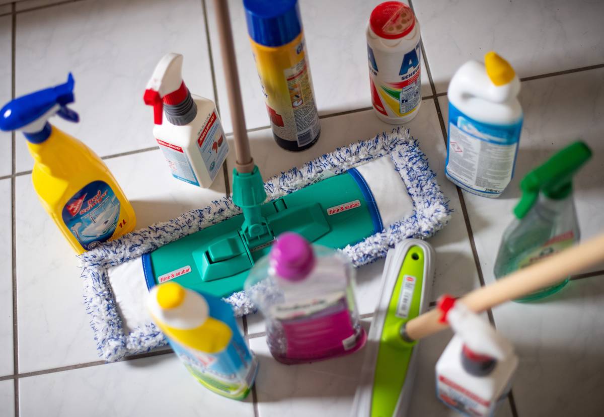 cleaning products on floor with wiper